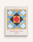 This art print features a hand-painted mosaic style tile featuring touches of blue, red and black with the words Barcelona, Espana in red below on a white background.