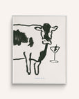 Art Print "Moo-tini" features a hand-painted black and white cow with a martini glass. The martini glass has an olive skewer in it.