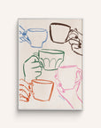 "Cafe Du Jour" features hands holding mugs in a cheerful toast hand-painted in multiple colors, on a white background.