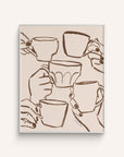 "Cafe Du Jour" features hands holding mugs in a cheerful toast hand-painted in brown, on a white background.