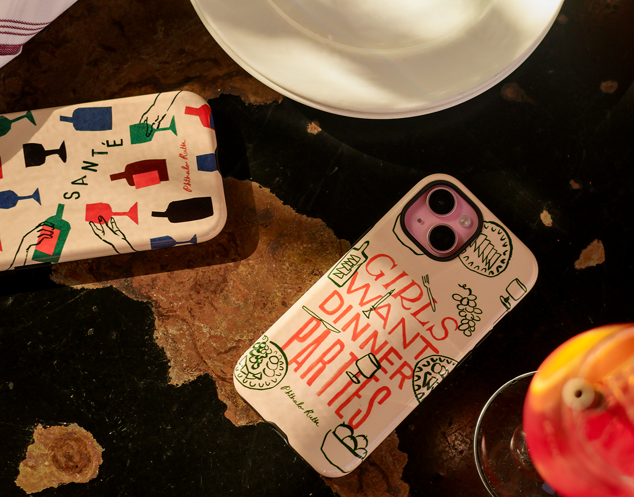 "Girls want dinner parties" printed on an iphone phone case next to an aperol spritz