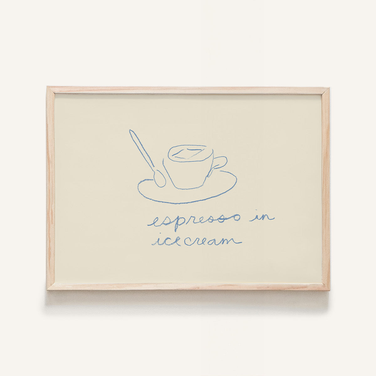 This mini art print features a simple blue tea cup and spoon, atop the phrase “Espresso in Ice Cream” on a white background.